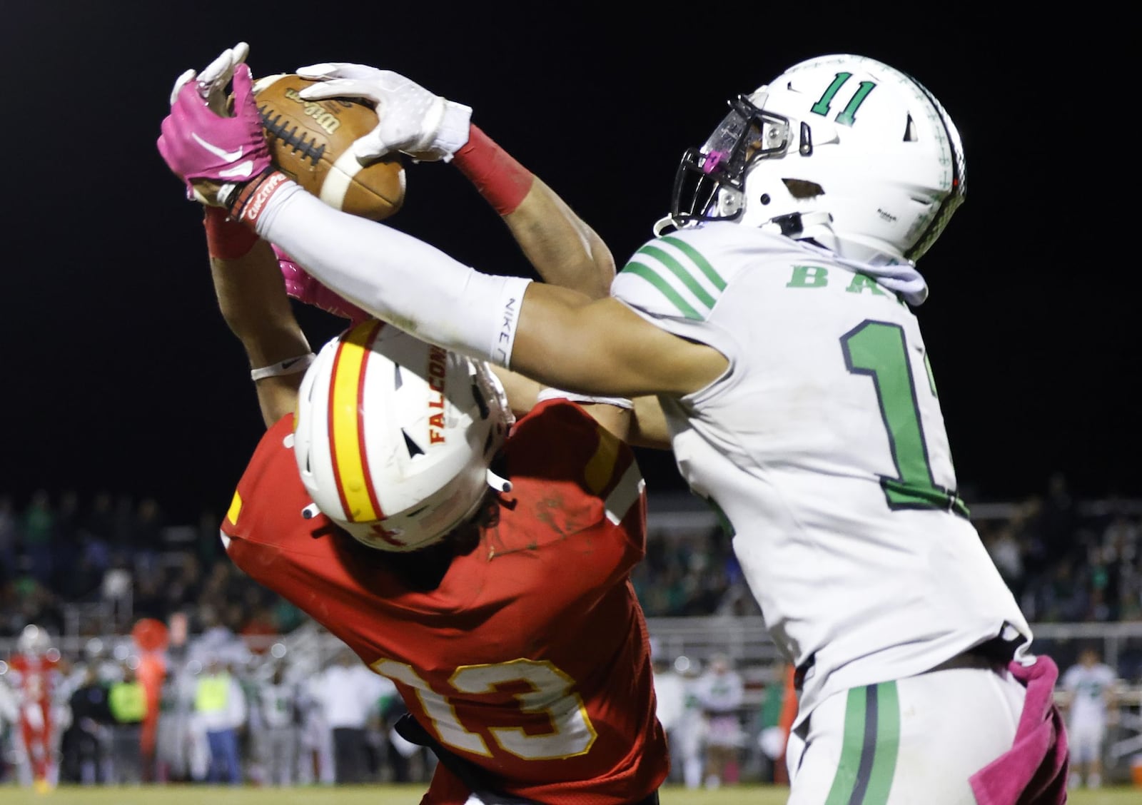 Badin's Braedyn Moore, right, intercepts a pass intended for Fenwick's Augie Quirch. Badin defeated Fenwick 14-6 in their football game Friday, Oct. 14, 2022 at Bishop Fenwick High School. NICK GRAHAM/STAFF