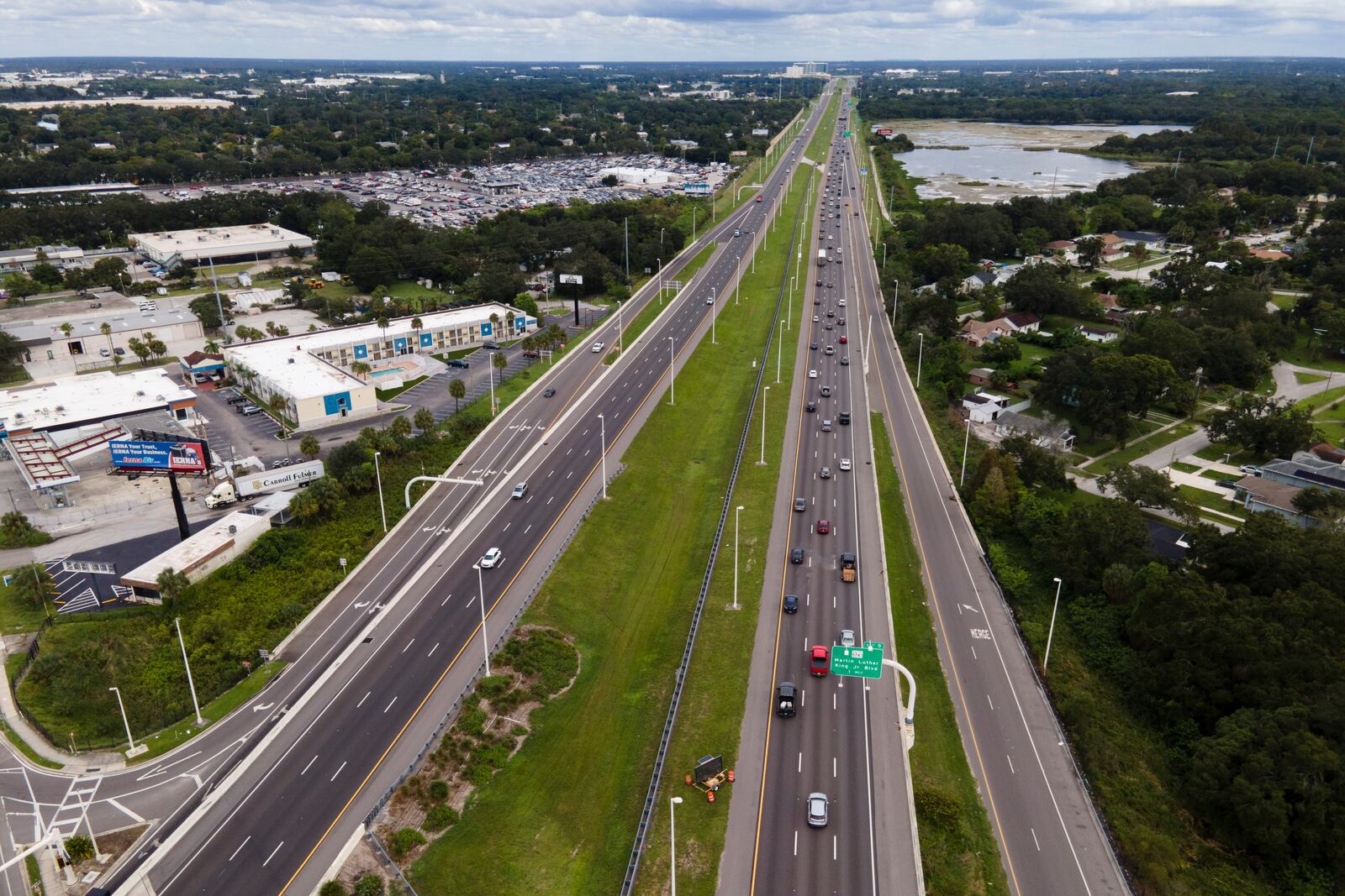 In this image taken with a drone, traffic flows eastbound along Interstate 4 as residents continue to follow evacuation orders ahead of Hurricane Milton, Tuesday, Oct. 8, 2024, in Tampa, Fla. (AP Photo/Julio Cortez)