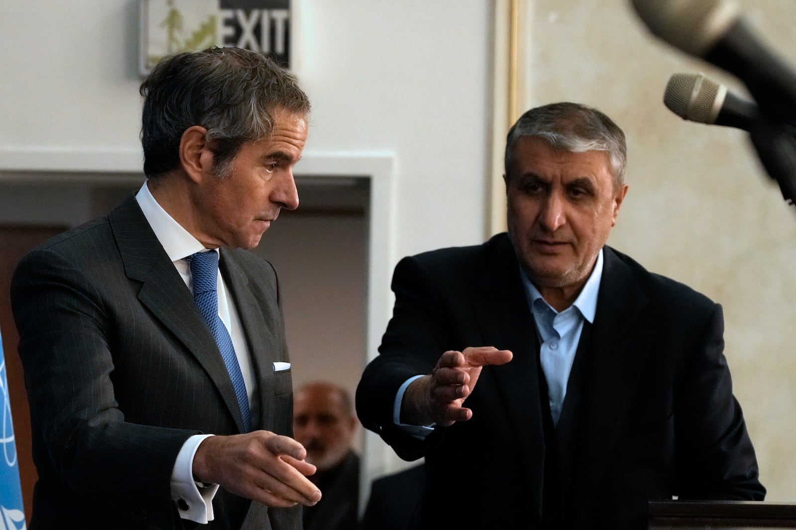 International Atomic Energy Agency, IAEA, Director General Rafael Mariano Grossi, left, and head of Atomic Energy Organization of Iran Mohammad Eslami gesture as they arrive for a press conference in Tehran, Iran, Thursday, Nov. 14, 2024. (AP Photo/Vahid Salemi)