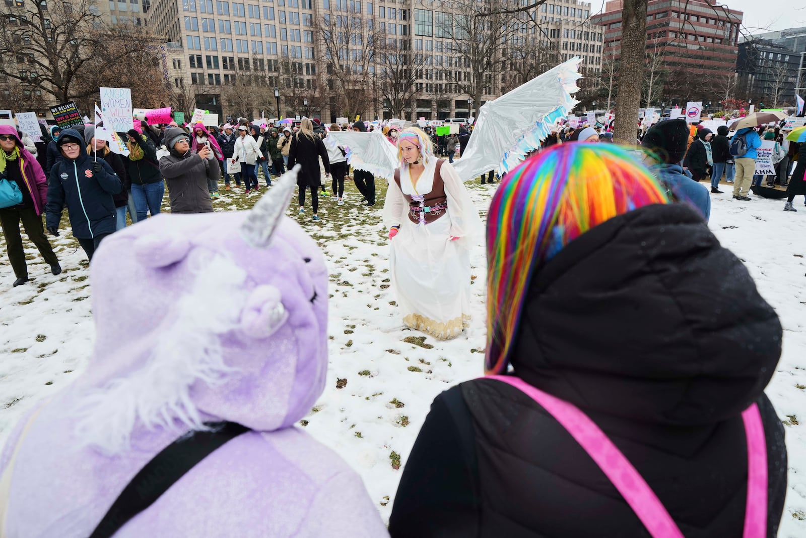 A group gathers at Franklin Park before the People's March, Saturday, Jan. 18, 2025, in Washington. (AP Photo/Julio Cortez)