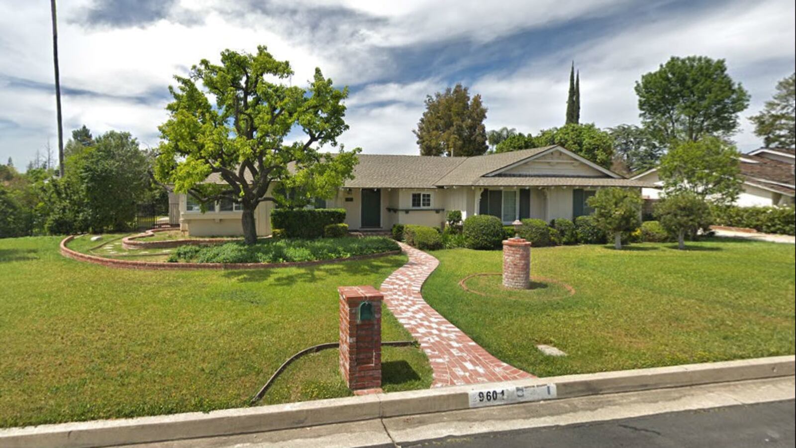 Pictured in an April 2019 Street View image is the home where assistant Los Angeles city attorney Eric Lertzman, 60, killed his wife, Sandy, also 60, and his son, Michael, 19, before killing himself Wednesday, Sept. 11, 2019.