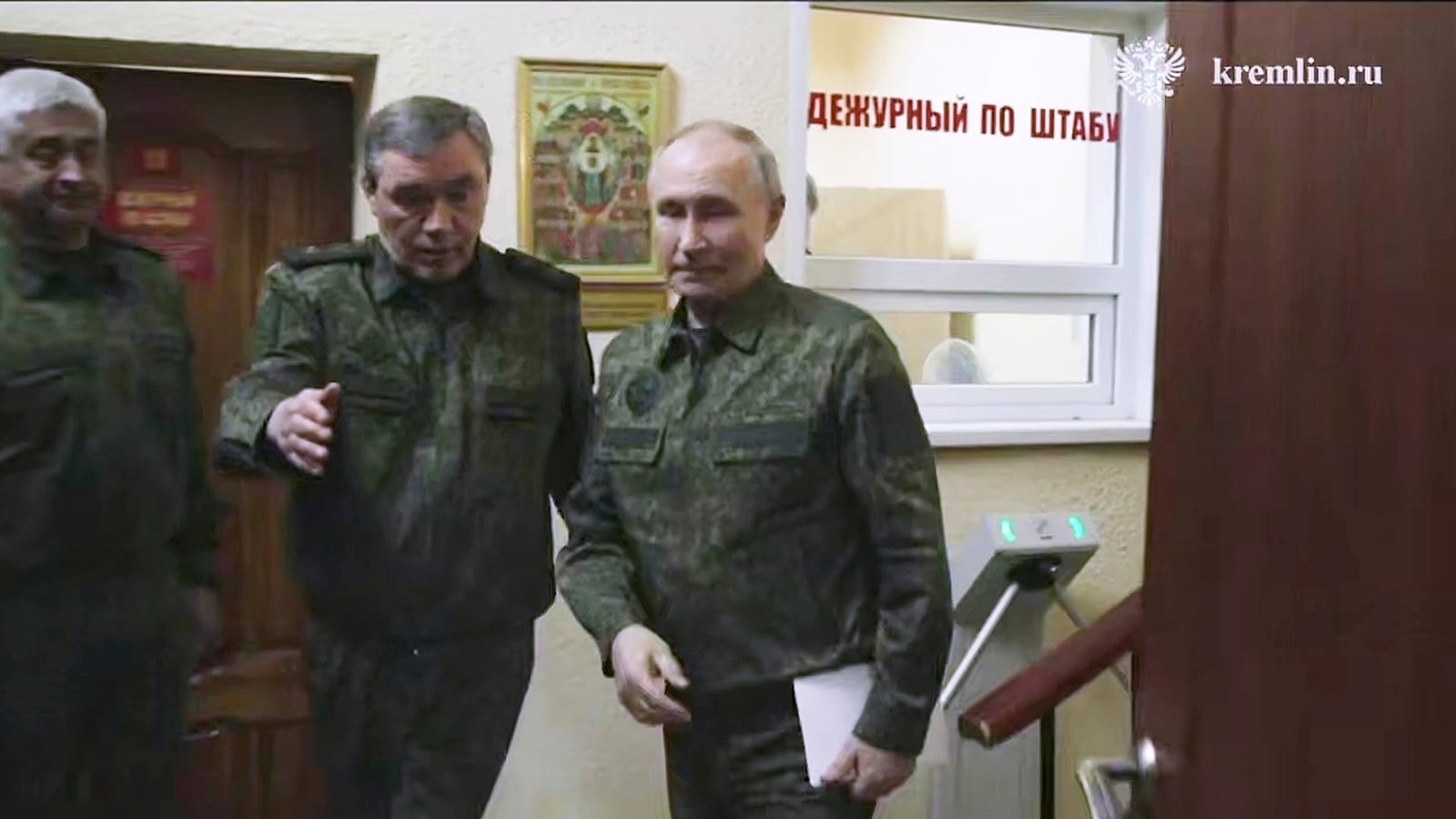 In this image made from video released by the Russian Presidential Press Service, on Wednesday, March 12, 2025, Russian President Vladimir Putin, right, accompanied by Russian Chief of General Staff Gen. Valery Gerasimov, second left, visits military headquarters in the Kursk region of Russia. (Russian Presidential Press Service via AP)