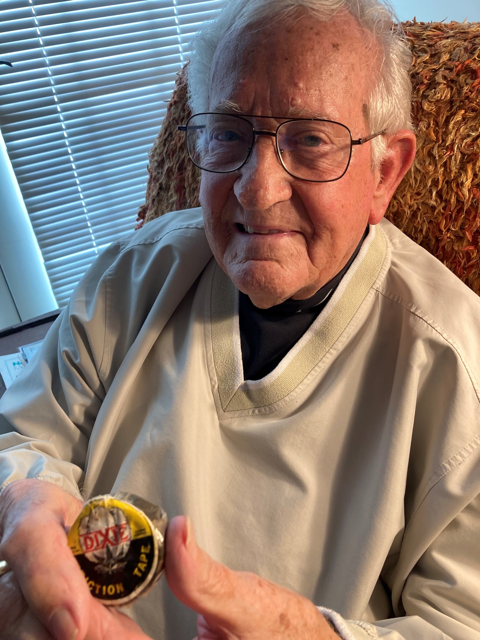 Elbert "Little Woody" Woodland, 89, shows black tape of the sort he used to extend the life of baseballs in his sandlot days. Photo by Tom Stafford