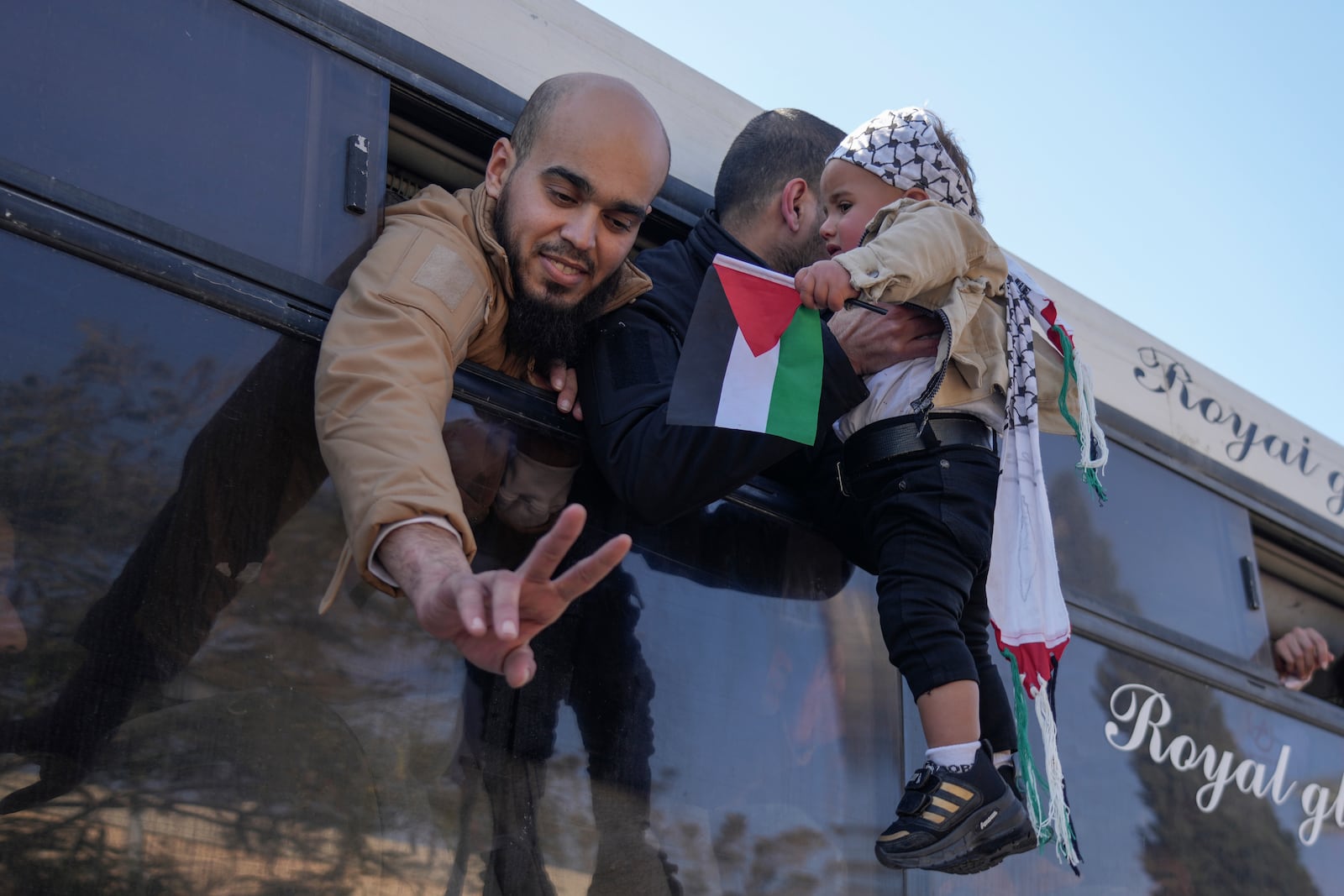 Freed Palestinian prisoners are greeted by relatives in Khan Younis, Gaza Strip, Saturday, Feb. 15, 2025, as they arrive in the Gaza Strip after being released from an Israeli prison following a ceasefire agreement between Hamas and Israel. (AP Photo/Abdel Kareem Hana)