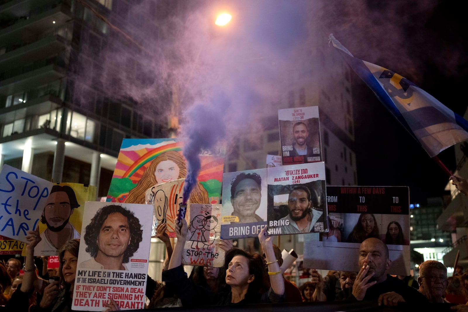 Relatives of Israelis held hostage by Hamas in the Gaza Strip and their supporters protest outside of the hotel where U.S. Secretary of State Antony Blinken is staying during a visit with Israeli leadership, in Tel Aviv, Tuesday, Oct. 22, 2024. (AP Photo/Maya Alleruzzo)