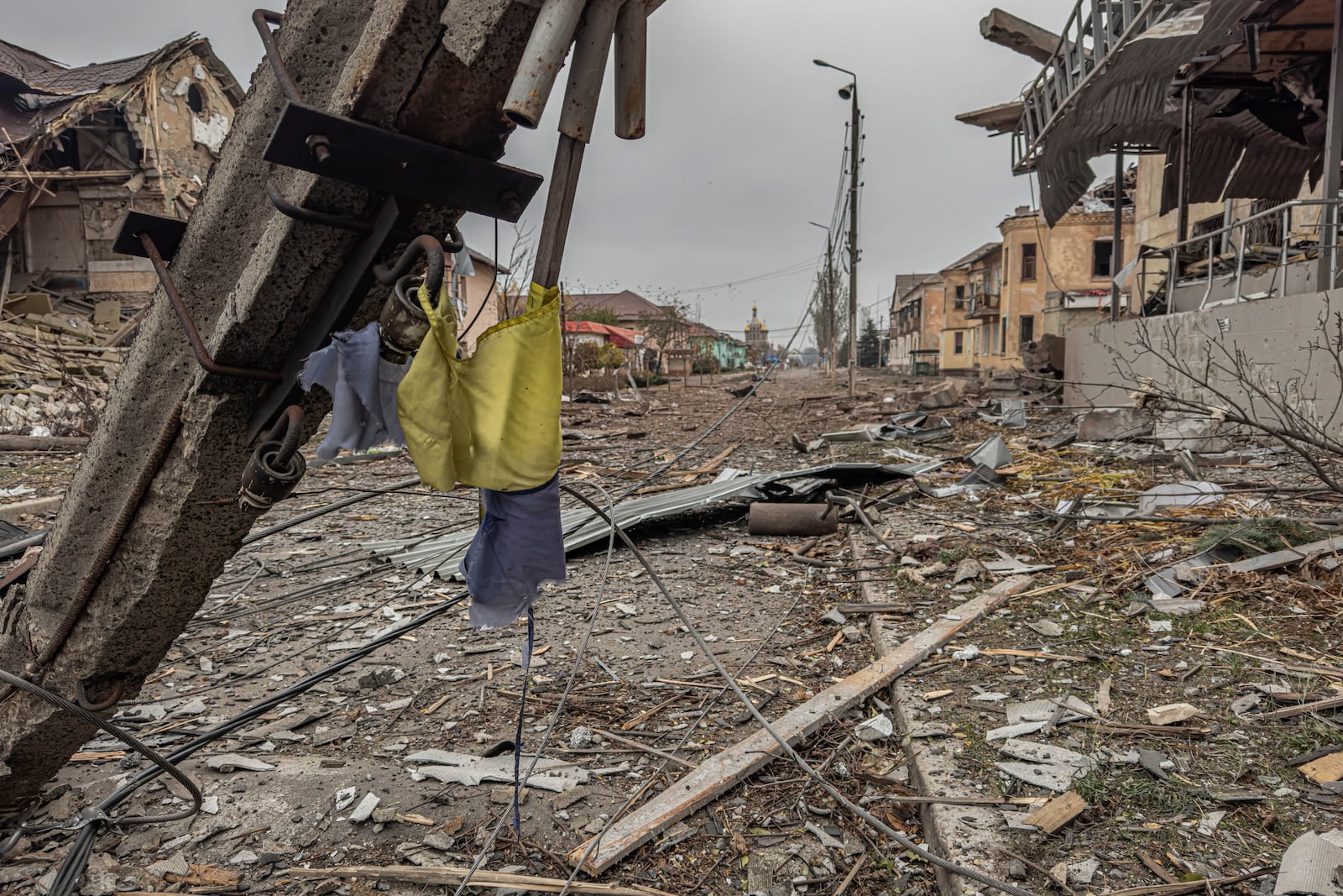 A central streets covered in debris from destroyed residential buildings after Russian bombing in Kurakhove, Donetsk region, Ukraine, on Nov. 7, 2024. (AP Photo/Anton Shtuka)