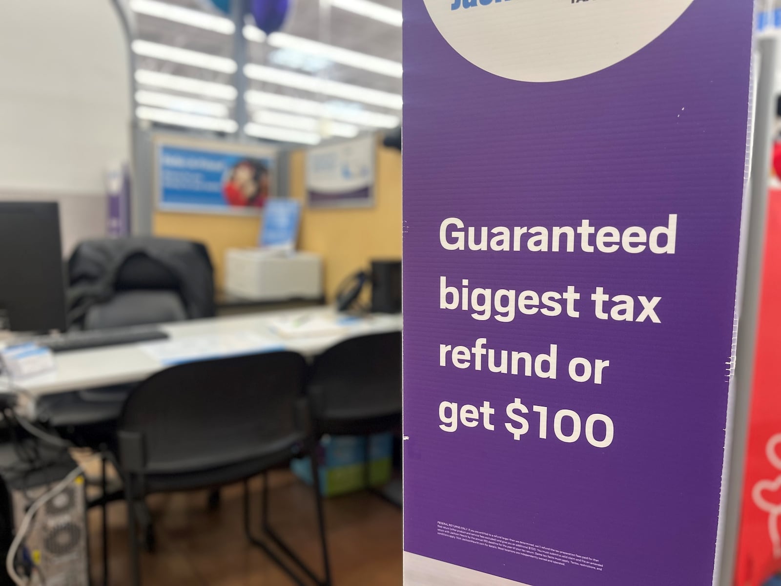 A tax preparation services booth at a local big-box store. CORNELIUS FROLIK / STAFF