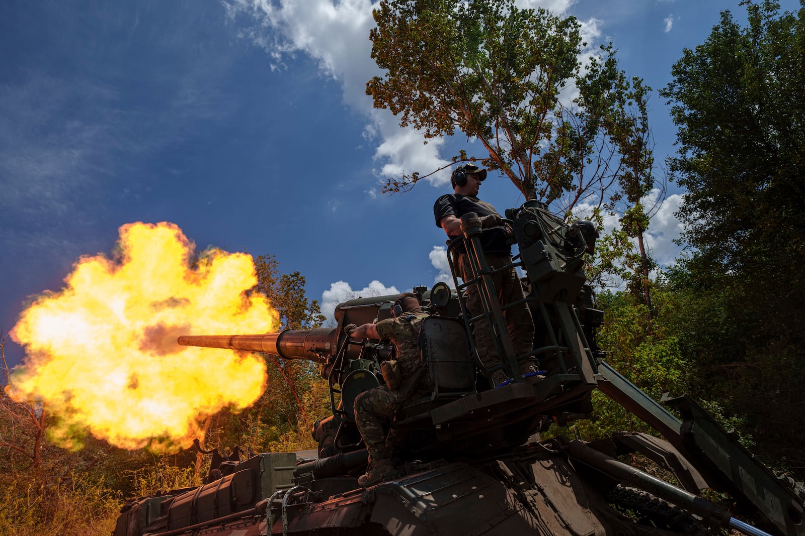 FILE - Ukrainian soldiers from the 43rd Artillery Brigade fire a howitzer toward Russian positions on the front line in the Donetsk region of eastern Ukraine on June 24, 2024. (AP Photo/Evgeniy Maloletka, File)