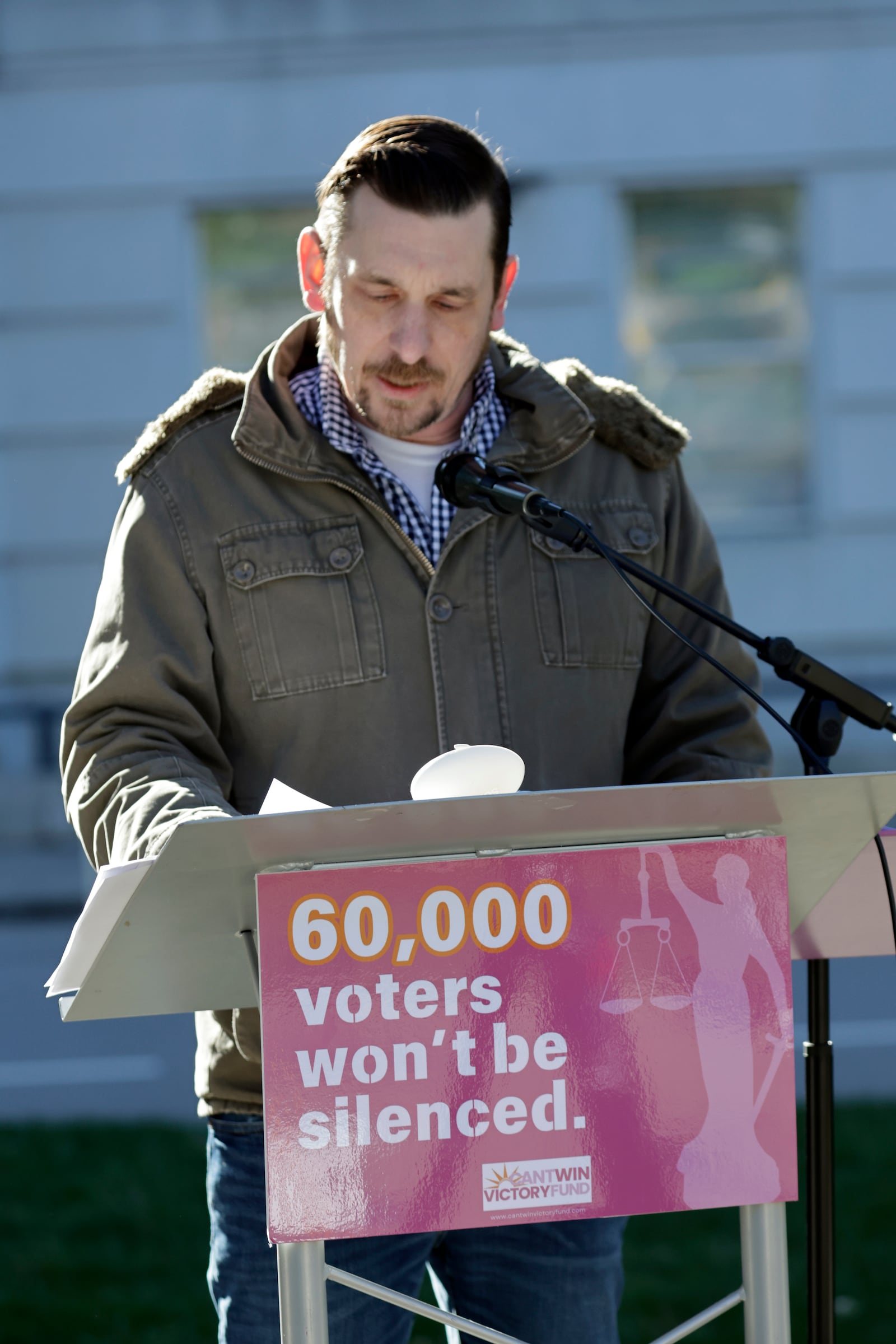 Ted Corcoran reads names from a list of over 60,000 people who cast ballots in the November 2024 election but whose votes have been challenged by Republican state Supreme Court candidate Jefferson Griffin in his extremely close race with Democratic Associate Justice Allison Riggs, Tuesday, Jan. 14, 2025, in Raleigh, N.C. (AP Photo/Chris Seward)