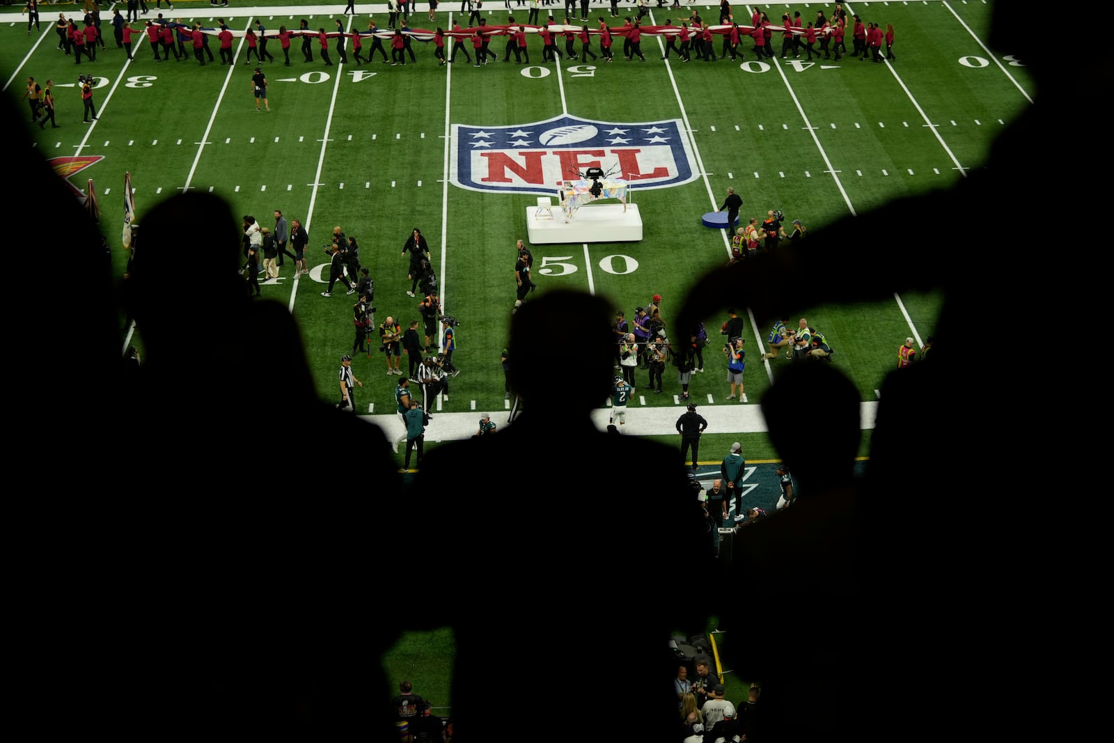 President Donald Trump, center, attends the NFL Super Bowl 59 football game between the Philadelphia Eagles and the Kansas City Chiefs, Sunday, Feb. 9, 2025, in New Orleans. (AP Photo/Ben Curtis)