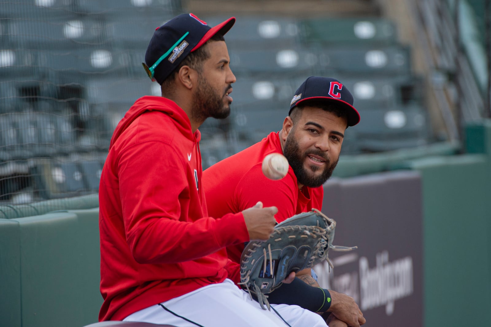 Cleveland Guardians bullpen coach Eric Rodriguez, left, chats with Pedro Avila during a baseball workout in Cleveland, Friday, Oct. 11, 2024, in preparation for Saturday's Game 5 of the American League Division Series against the Detroit Tigers.(AP Photo/Phil Long)