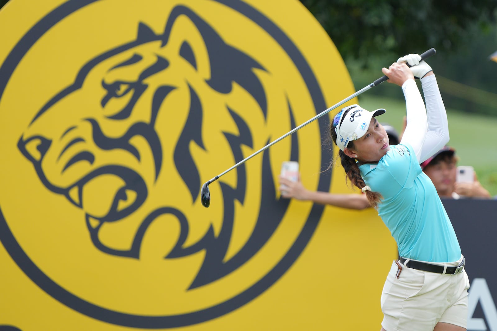 Jean Thitikul of Thailand, watches her tee shot on the 16th hole during the LPGA Tour's Maybank Championship at Kuala Lumpur Golf and Country club in Kuala Lumpur, Sunday, Oct. 27, 2024. (AP Photo/Vincent Thian)