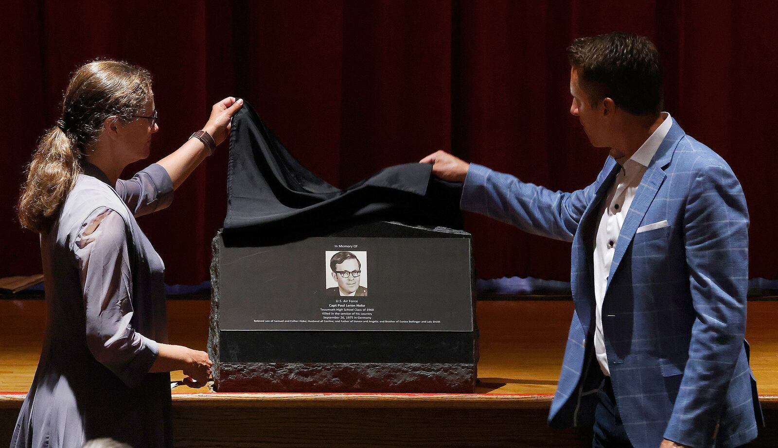 The children of Capt. Paul Leron Hoke, Angela Greenshields and Steven Hoke, unveil a marker Friday, Aug. 16, 2024 at Tecumseh High School in memory their father. Hoke, a 1960 graduate from Tecumseh, was killed serving his country Sept. 26, 1975 in Germany. MARSHALL GORBY\STAFF