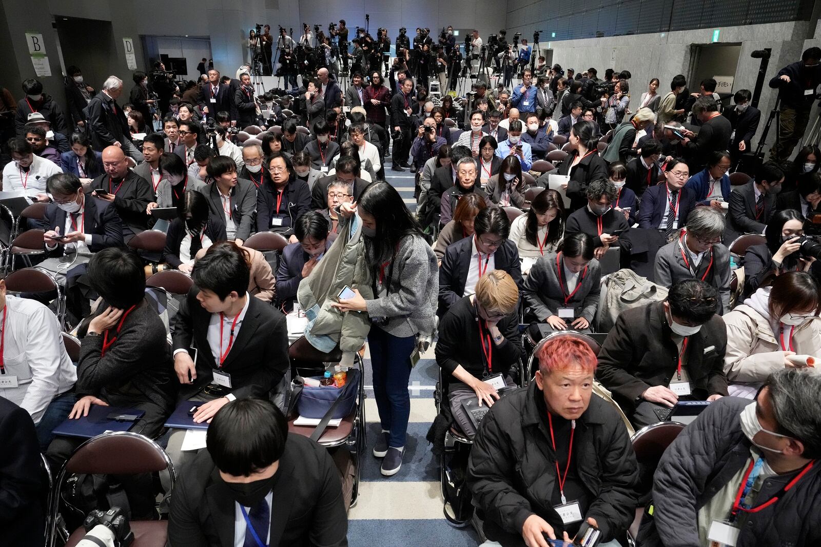 Members of media outlets wait for the start of a news conference which will be held by senior officials from Fuji Television and its parent company at the Fuji Television headquarter in Tokyo, Monday, Jan. 27, 2025. (AP Photo/Eugene Hoshiko)