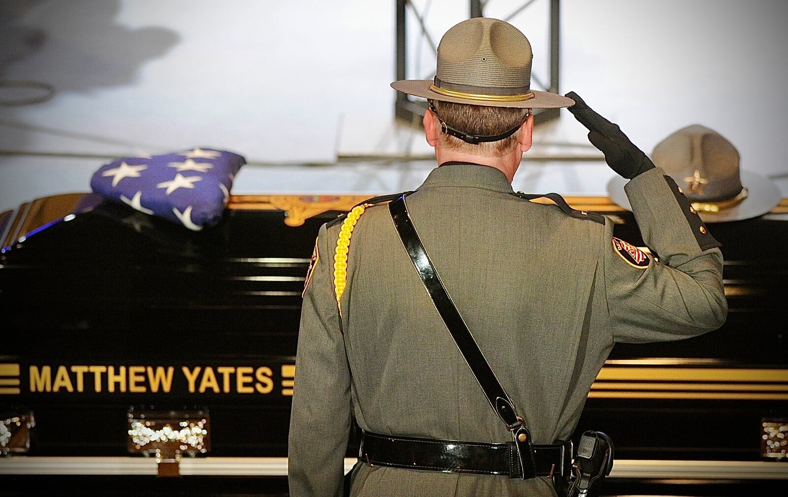 A member of the Clark County Sheriff’s Office salutes the casket of fallen deputy Matthew Yates Monday Aug. 1, 2022. MARSHALL GORBY \STAFF