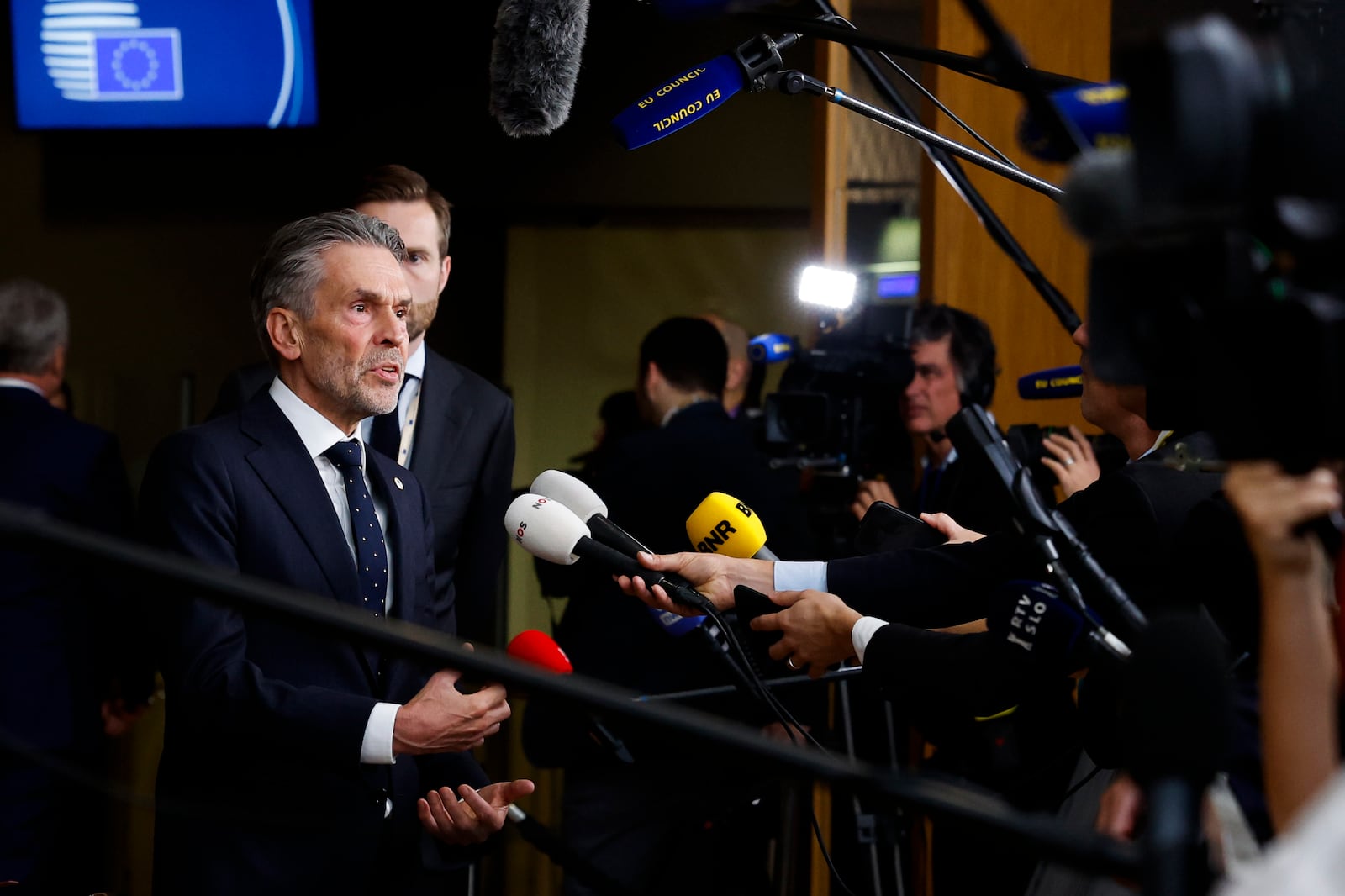 Netherland's Prime Minister Dick Schoof talks to journalists as he arrives to an EU summit in Brussels, Thursday, Oct. 17, 2024. (AP Photo/Geert Vanden Wijngaert)