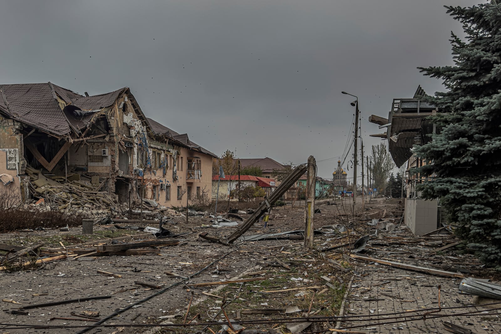 A central streets covered in debris from destroyed residential buildings after Russian bombing in Kurakhove, Donetsk region, Ukraine, on Nov. 7, 2024. (AP Photo/Anton Shtuka)