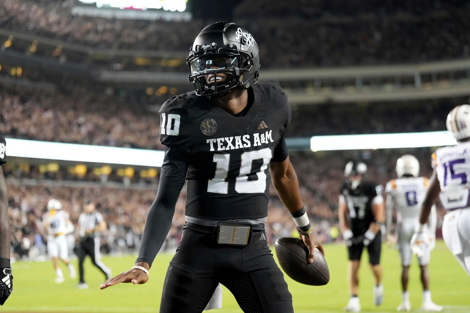 Texas A&M quarterback Marcel Reed (10) reacts after scoring a touchdown against LSU during the third quarter of an NCAA college football game Saturday, Oct. 26, 2024, in College Station, Texas. (AP Photo/Sam Craft)