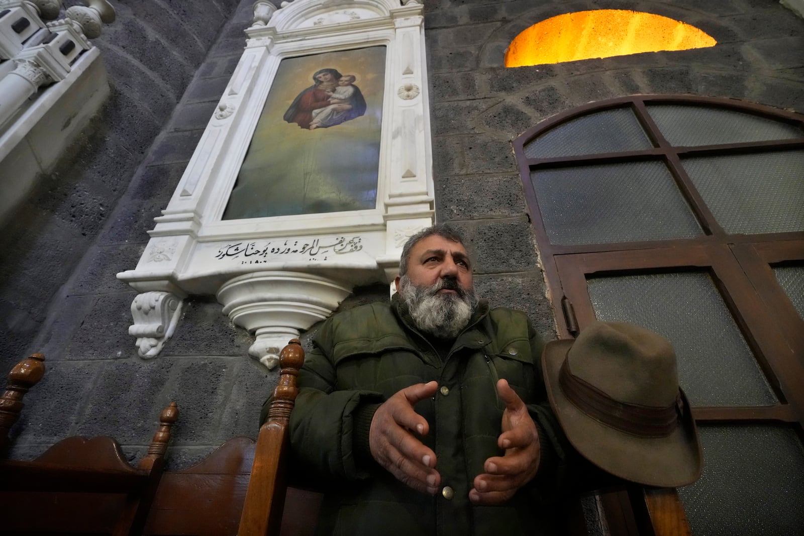 A Syrian Christians man prays during the first Sunday Mass since Syrian President Bashar Assad's ouster, at Mariamiya Orthodox Church in old Damascus, Syria, Sunday, Dec. 15, 2024. (AP Photo/Hussein Malla)