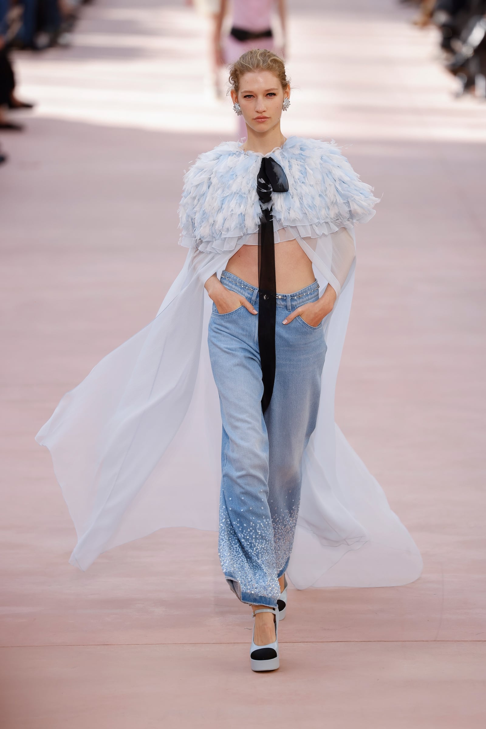 A model wears a creation as part of the Chanel Spring/Summer 2025 collection presented Tuesday, Oct. 1, 2024, in Paris. (Photo by Vianney Le Caer/Invision/AP)