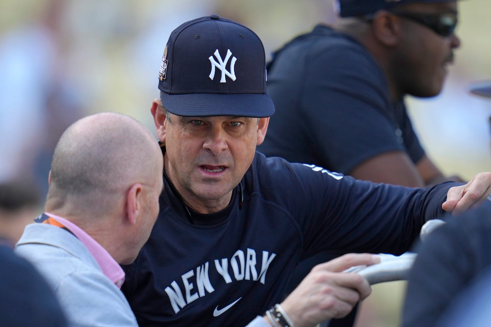 New York Yankees manager Aaron Boone, right, talks with general manager Brian Cashman during batting practice before Game 1 of the baseball World Series, Friday, Oct. 25, 2024, in Los Angeles. (AP Photo/Julio Cortez)