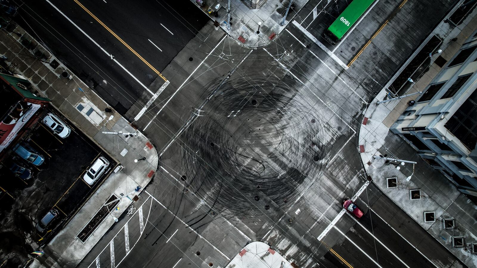 Tires mark the intersection of East Third and Jefferson Streets in downtown Dayton Tuesday January 17, 2023. Over the weekend, multiple vehicles did donuts in an activity called 'hooning'. JIM NOELKER/STAFF