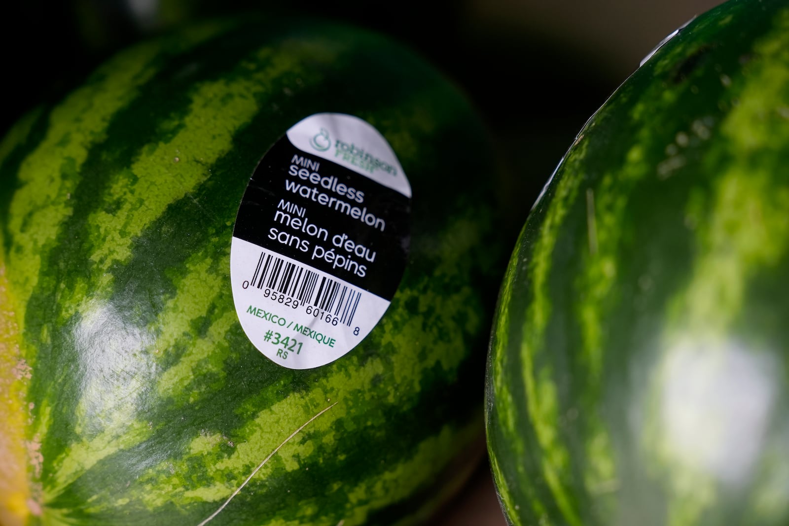 Mini seedless watermelons for sale are displayed at a grocery store in San Francisco, Wednesday, March 5, 2025. (AP Photo/Jeff Chiu)