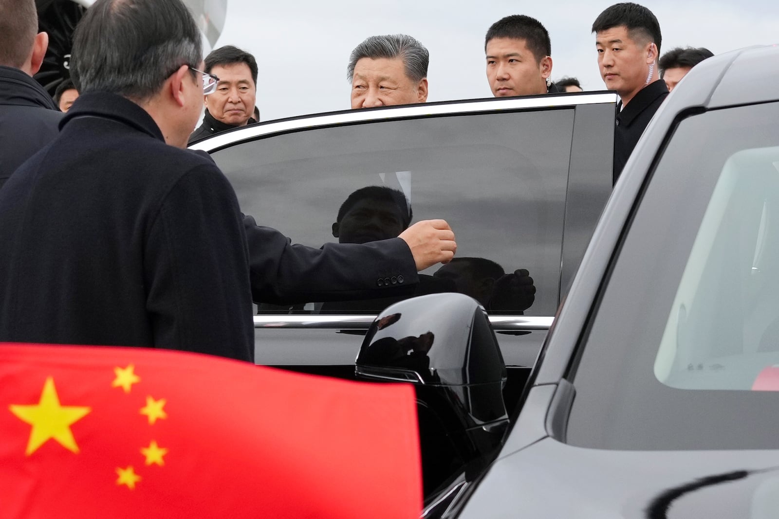 Chinese President Xi Jinping, third right, sits into a car upon his arrival at Kazan International Airport prior to the BRICS Summit in Kazan, Russia, Tuesday, Oct. 22, 2024. (Alexander Vilf/Photo host brics-russia2024.ru via AP)