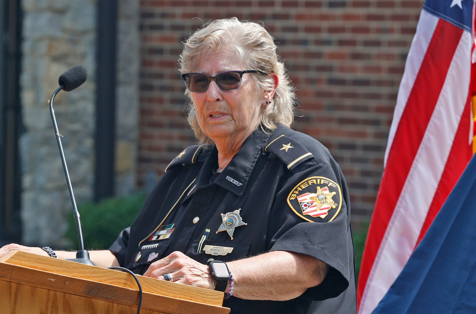 Clark County Sheriff Deb Burchett speaks during the new Dispatch Center dedication ceremony Friday, August 25, 2023. BILL LACKEY/STAFF