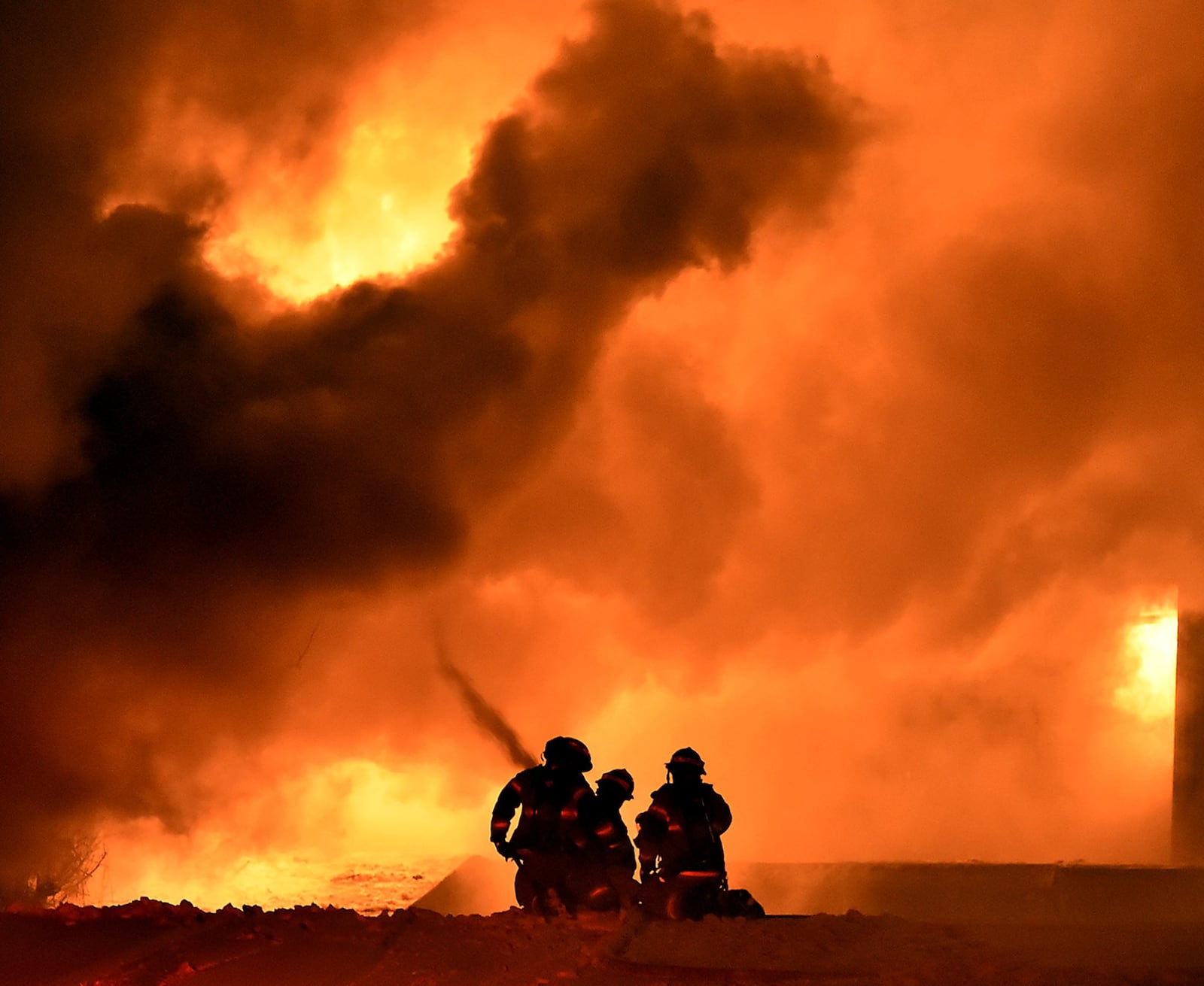 Members of the Springfield Fire Division battle a five alarm fire at Tri-State Pallet in downtown Springfield on Jan. 6, 2015. Bill Lackey/Staff