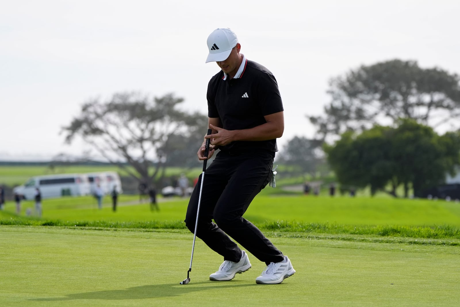 Ludvig Åberg, of Sweden, reacts after missing a putt on the 17th green of the South Course at Torrey Pines during the final round of the Genesis Invitational golf tournament Sunday, Feb. 16, 2025, in San Diego. (AP Photo/Gregory Bull)