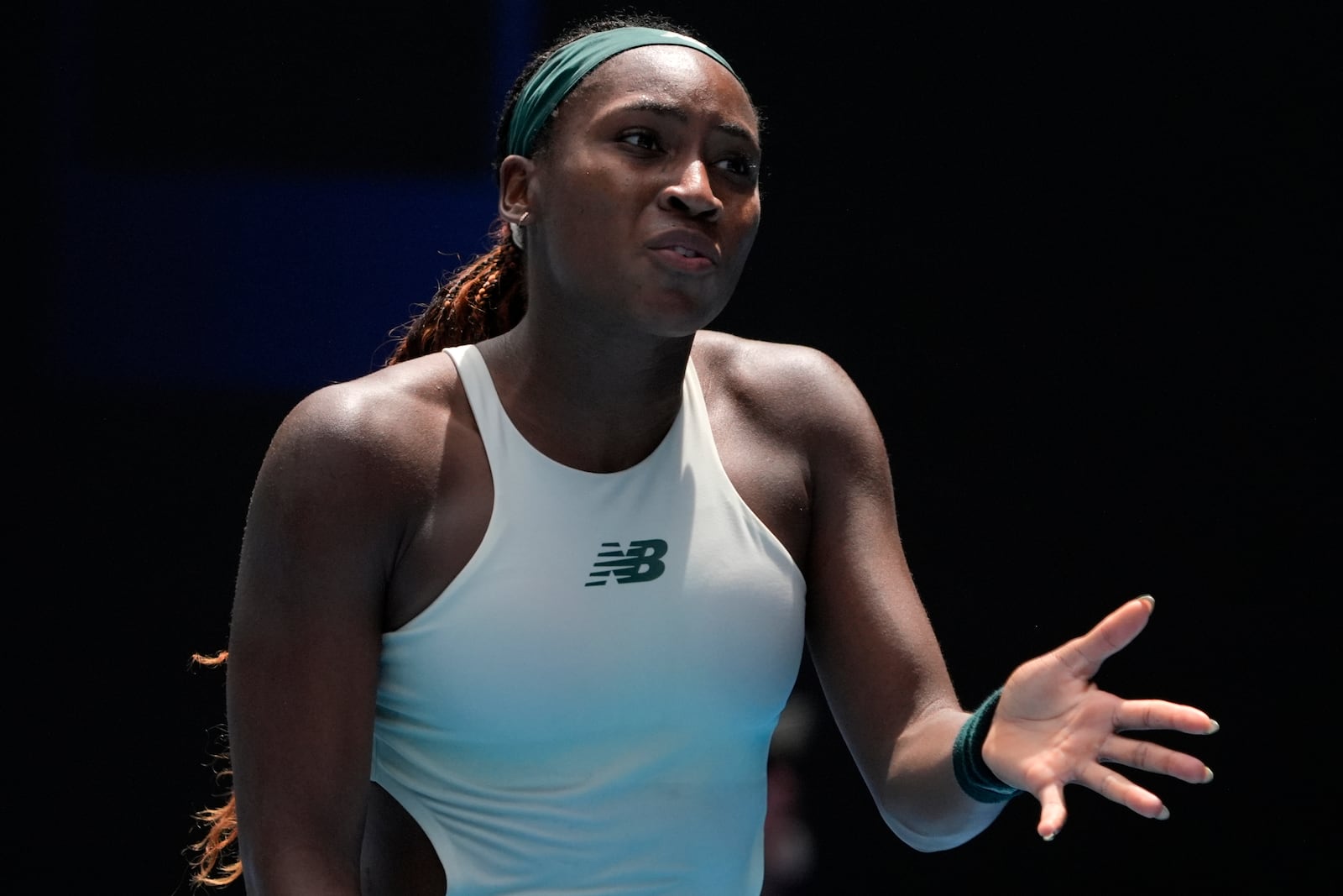 Coco Gauff of the U.S. reacts during a fourth round match against Belinda Bencic of Switzerland at the Australian Open tennis championship in Melbourne, Australia, Sunday, Jan. 19, 2025. (AP Photo/Asanka Brendon Ratnayake)