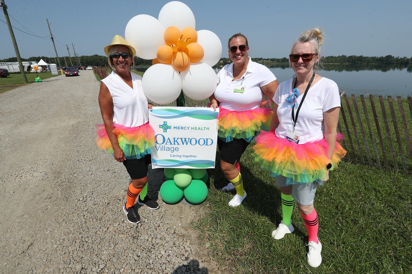 Members of the Oakwood Village staff were having fun Tuesday during the Golden Anniversary drive-thru at the Clark County Fair. BILL LACKEY/STAFF