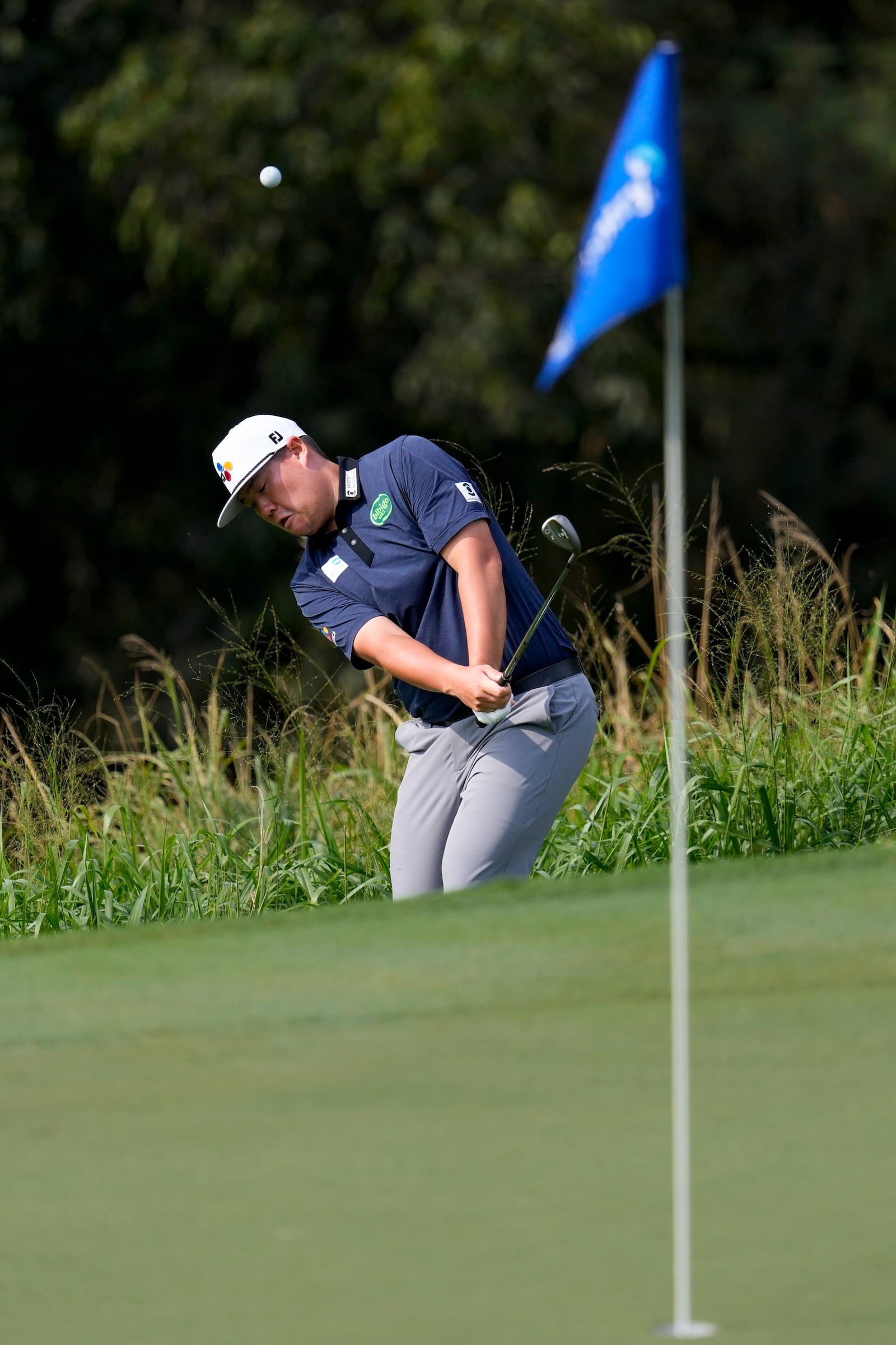 Sungjae Im hits onto the eighth green during the third round of The Sentry golf event, Saturday, Jan. 4, 2025, at Kapalua Plantation Course in Kapalua, Hawaii. (AP Photo/Matt York)