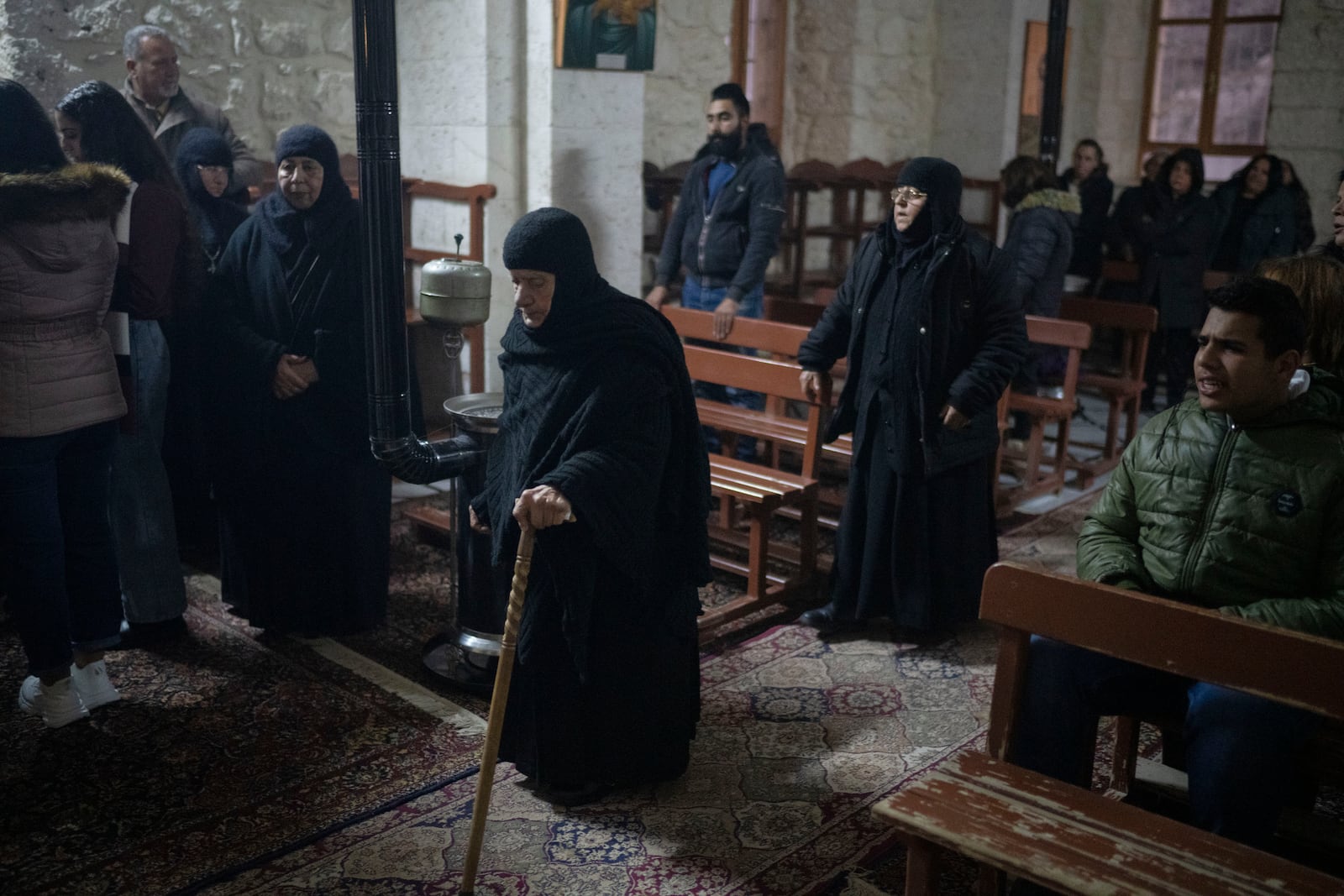 Christians attend the Christmas mass in the Greek Orthodox convent Saint Takla, in Maaloula, some 60 km northern Damascus, Syria, Tuesday, Dec. 24, 2024. (AP Photo/Leo Correa)