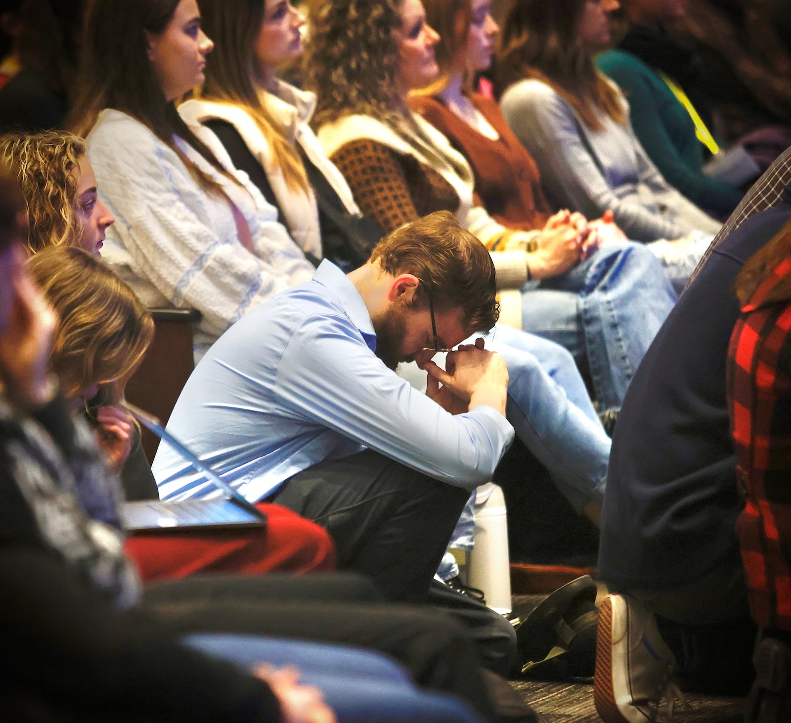 A student prays during a service for Grace Maxwell at Cedarville University Friday, January 31, 2025. MARSHAL GORBY\STAFF