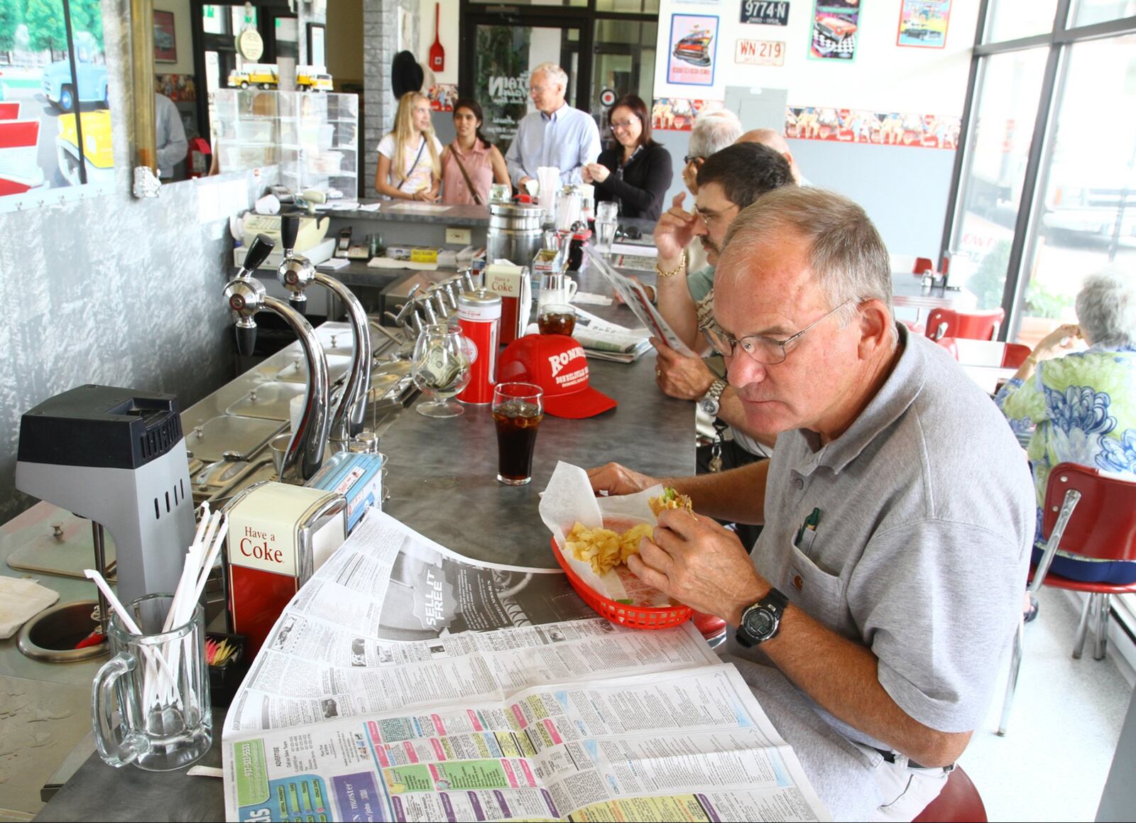 Ed Jones, who works for CodeBlue, enjoys a hamburger at The Fountain on Main during a busy lunch time on Tuesday. The new lease from Clark Schaefer Hackett announced Monday brings the Bushnell Building in downtown Springfield to near occupancy. Other building occupants include CodeBlue and restaurant The Fountain on Main, which this week marks its tenth anniversary. Building owner Jim Lagos showed off various areas of the Bushnell on Tuesday, July 9, 2013, including the fifth floor construction. Barbara J. Perenic/Staff