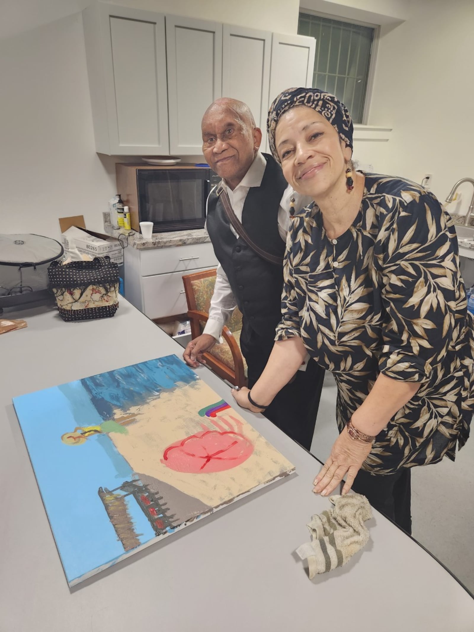 Columbus pastor Johannes Christian, blinded by a rock thrown from a Clark County highway overpass in 2001, is reinventing himself as a painter at age 73, with help from fellow artist Lanai Ashé. Contributed photo, courtesy Lanai Ashe