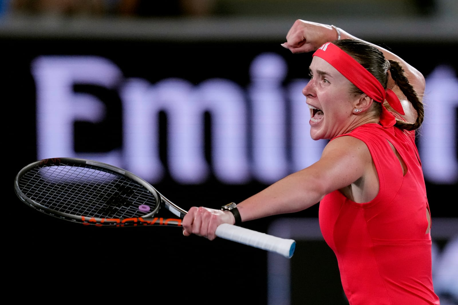 Elina Svitolina of Ukraine celebrates after defeating Jasmine Paolini of Italy in their third round match at the Australian Open tennis championship in Melbourne, Australia, Saturday, Jan. 18, 2025. (AP Photo/Vincent Thian)