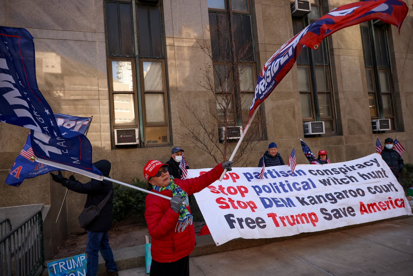 Demonstrators protest outside Manhattan criminal court before the start of the sentencing in President-elect Donald Trump's hush money case, Friday, Jan. 10, 2025, in New York. (AP Photo/Yuki Iwamura)