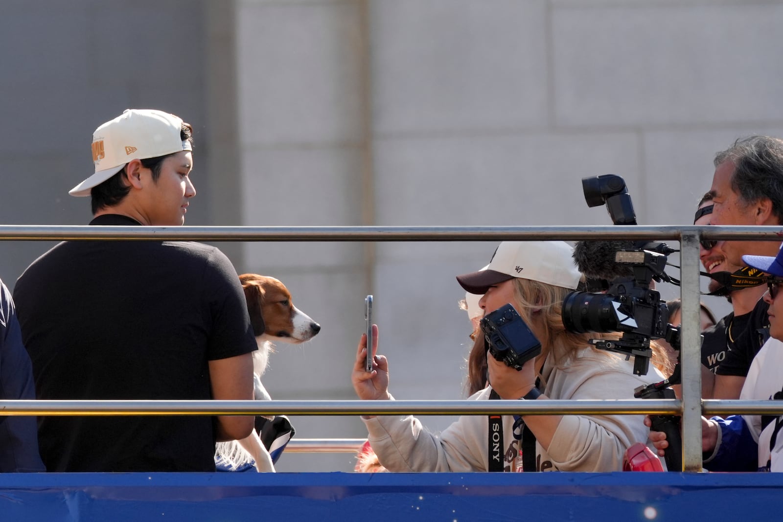 Los Angeles Dodgers' Shohei Ohtani is photographed with his dog Decoy during the Los Angeles Dodgers baseball World Series championship parade Friday, Nov. 1, 2024, in Los Angeles. (AP Photo/Jae C. Hong)