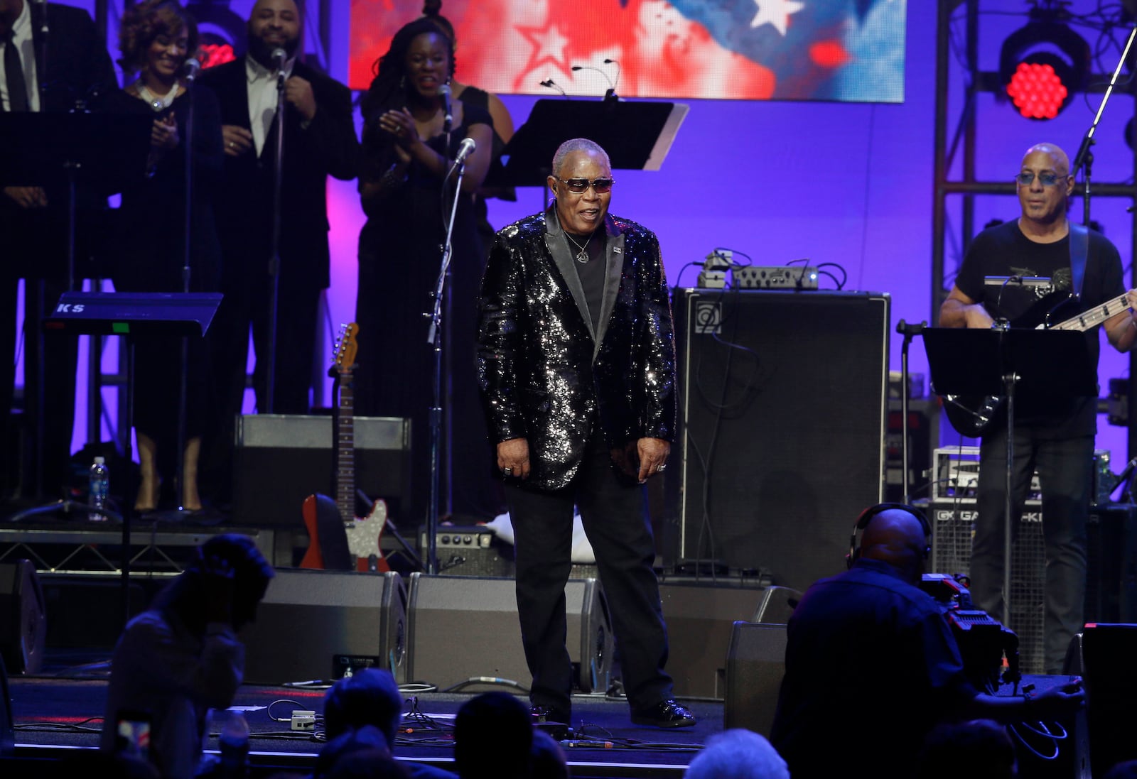 FILE - Sam Moore walks on stage to perform during a hurricanes relief concert in College Station, Texas, Oct. 21, 2017. (AP Photo/LM Otero, File)