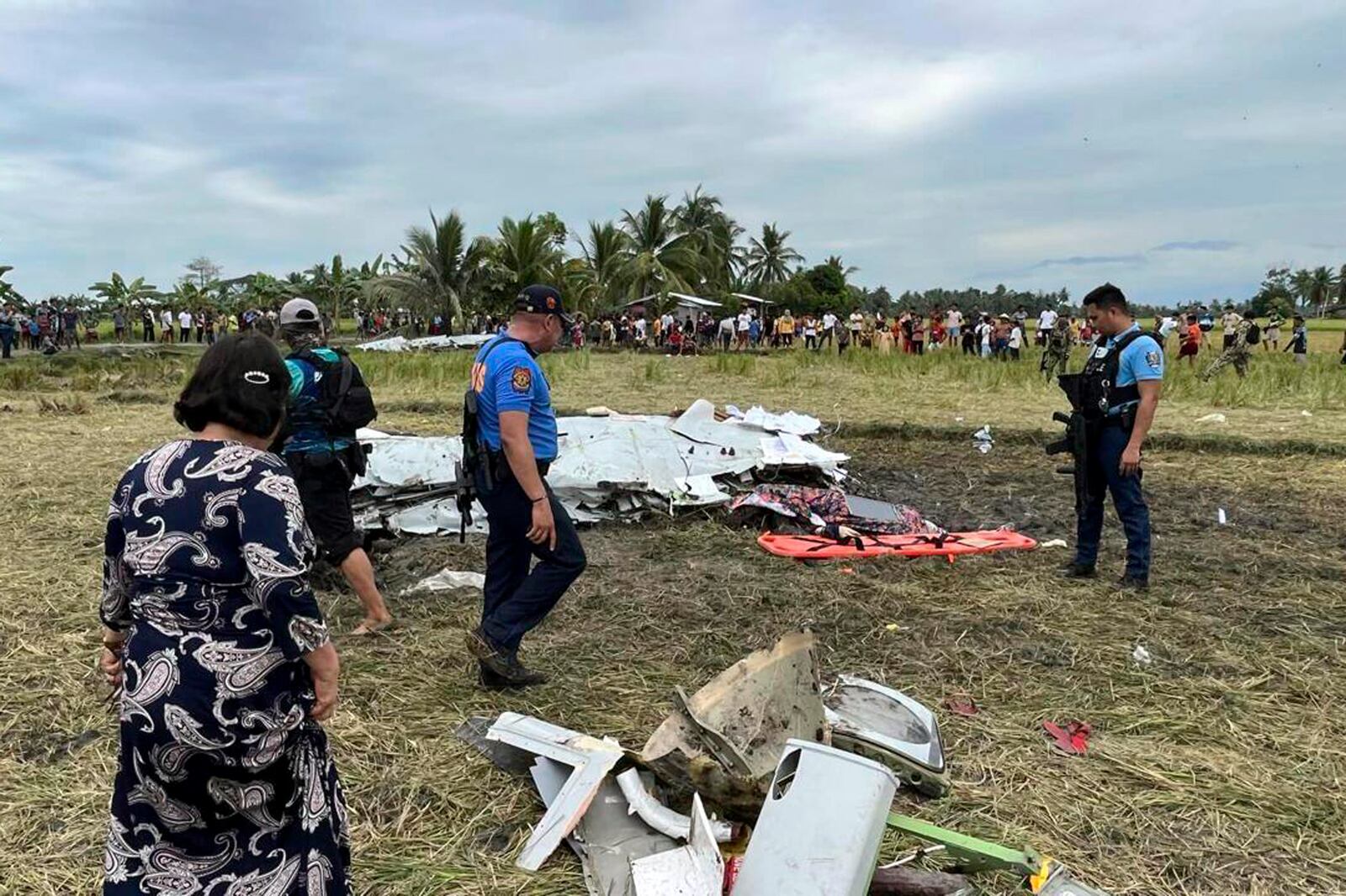 Wreckage of airplane in a rice field in Maguindanao del Sur province, Philippines, after officials say a U.S. military-contracted plane has crashed in a rice field in the southern Philippines, killing all four people on board, on Thursday Feb. 6, 2025. (Sam Mala/UGC via AP)