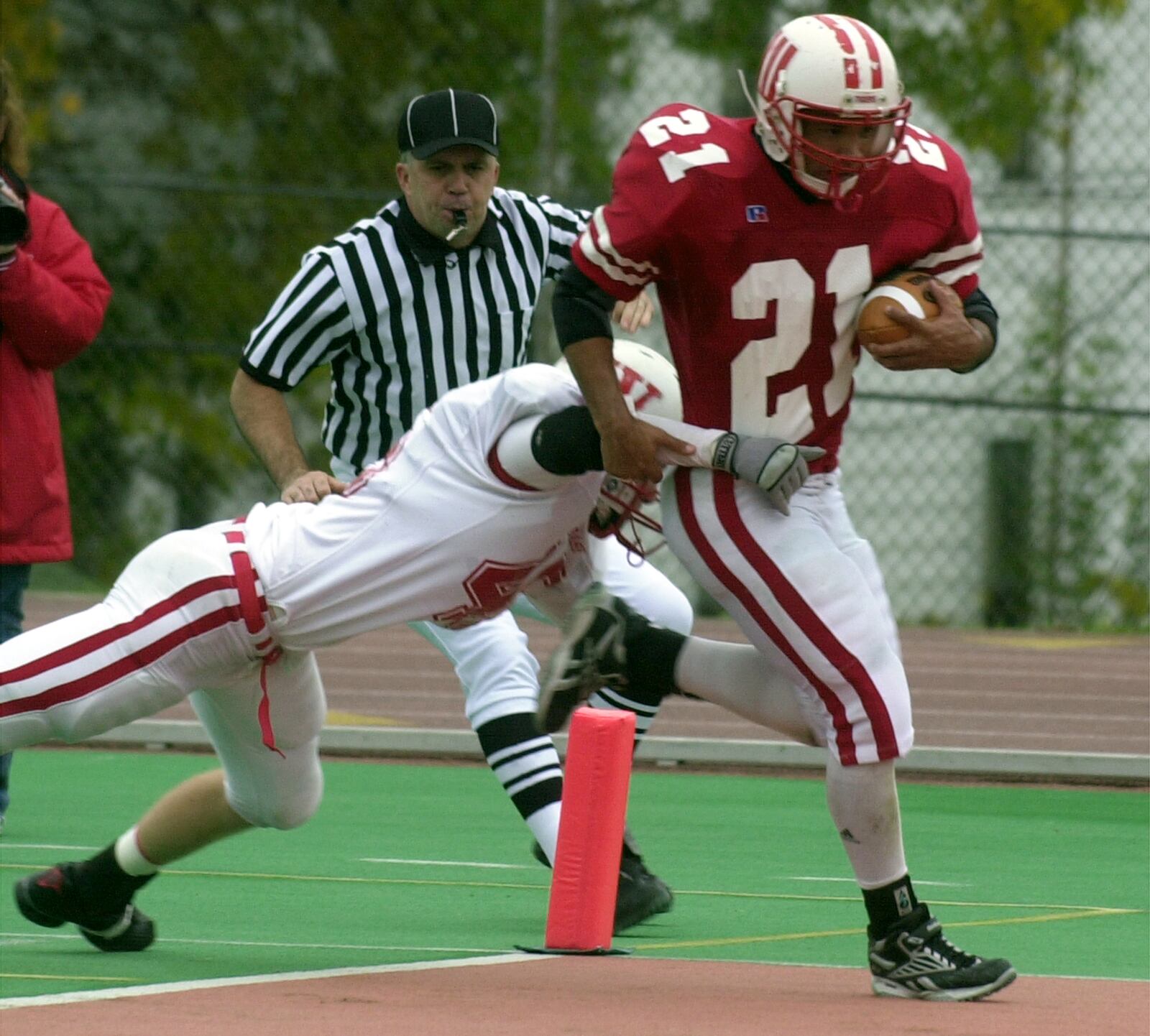 Wittenberg's Tristan Murray runs into the end zone for one of his touchdowns Saturday as Wabash's Frank Knez tries to make a diving tackle but is too late.