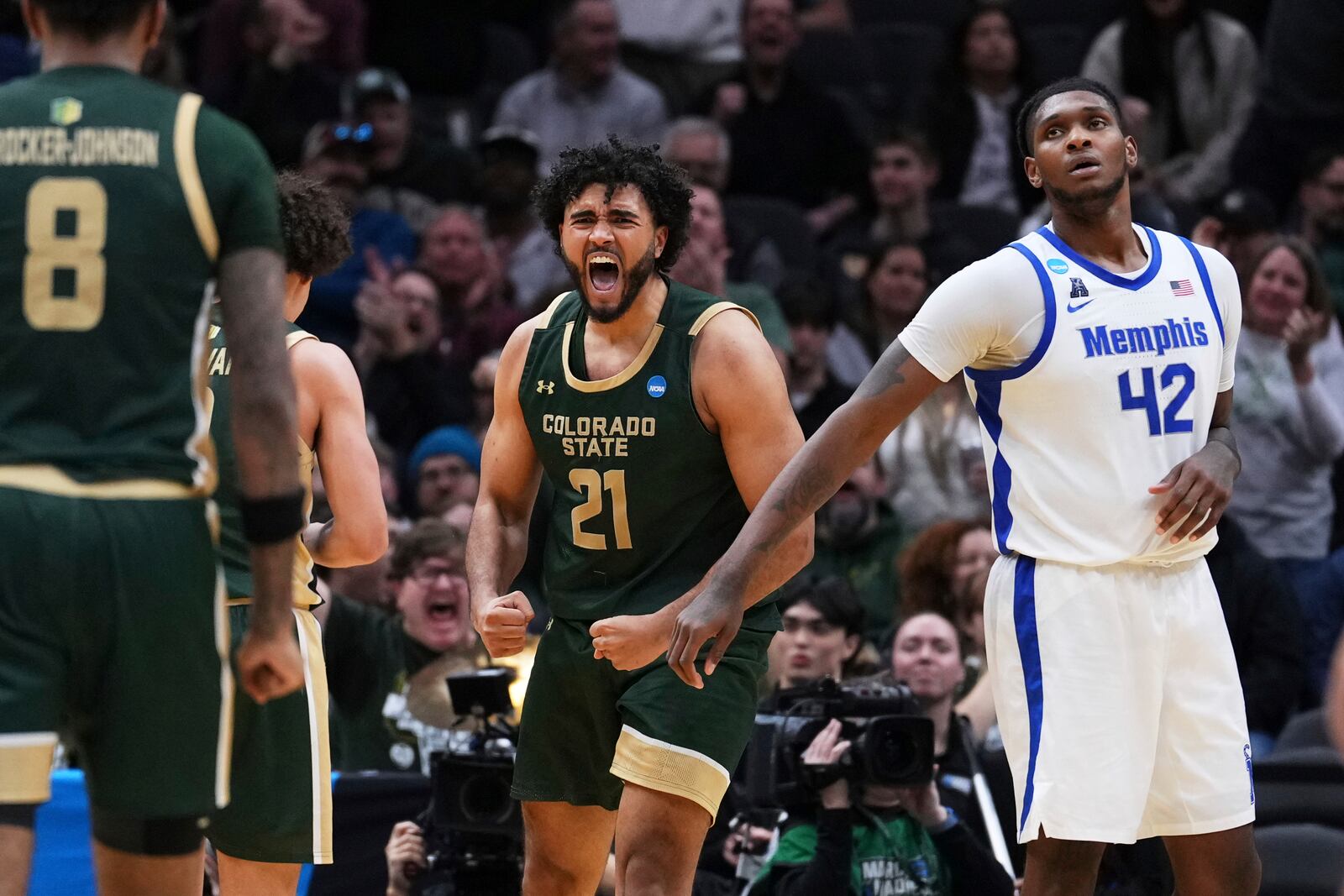 Colorado State forward Rashaan Mbemba (21) reacts to drawing a foul from Memphis forward Nicholas Jourdain as forward Dain Dainja (42) looks on during the second half in the first round of the NCAA college basketball tournament, Friday, March 21, 2025 in Seattle. (AP Photo/Lindsey Wasson)