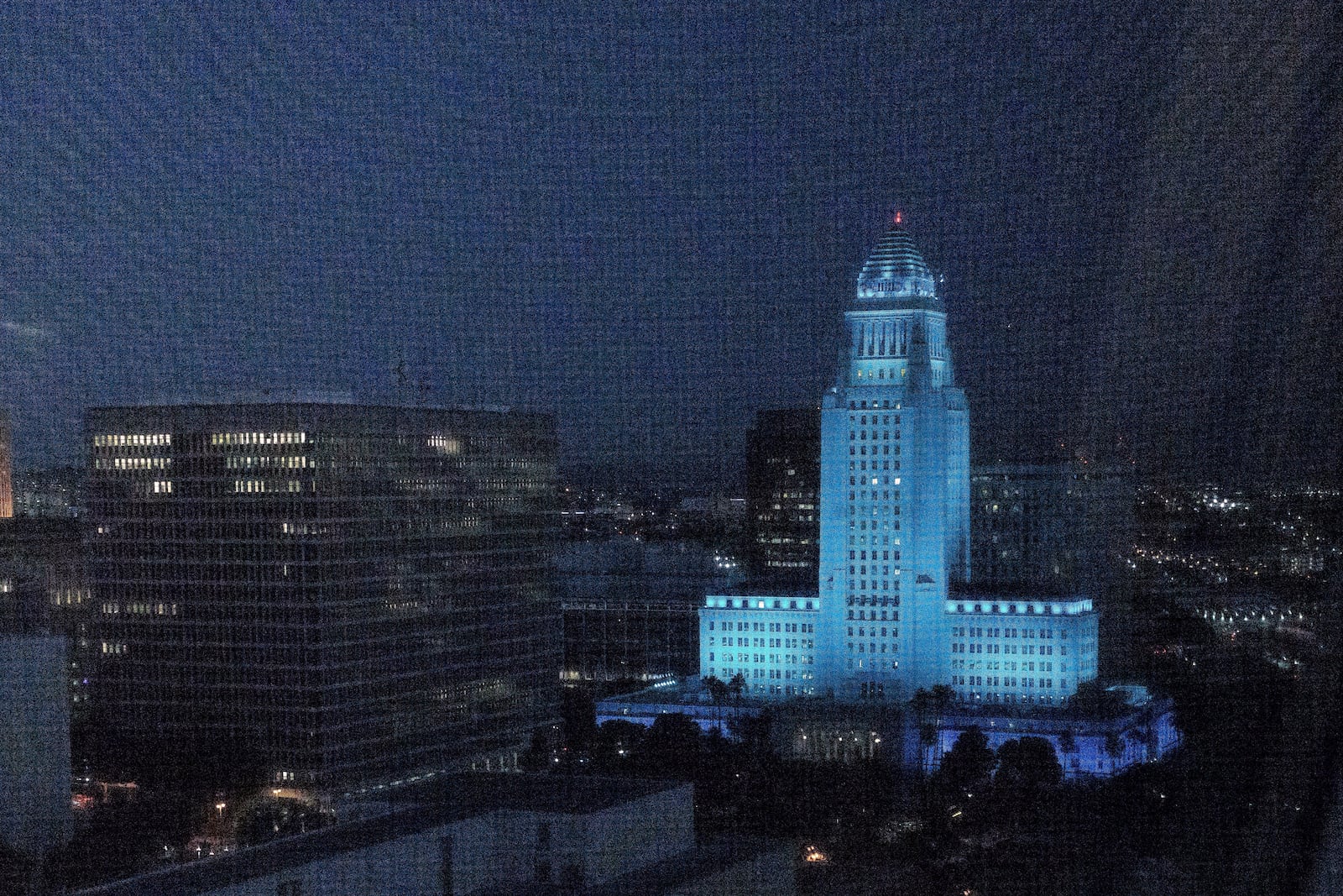 Los Angeles City Hall glows in Dodger Blue to celebrate the Dodgers' World Series Championship in Los Angeles on Thursday, Oct. 31, 2024. (AP Photo/Damian Dovarganes)