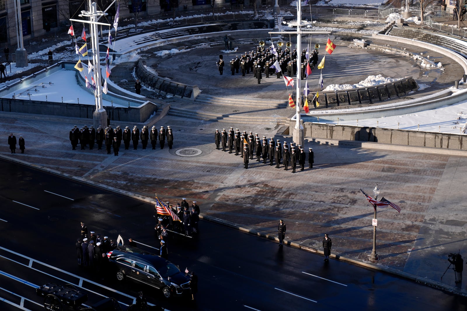 The flag-draped casket of former President Jimmy Carter is transferred to a horse-drawn caisson at the U.S. Navy Memorial before traveling on to the Capitol in Washington, Tuesday, Jan. 7, 2025, where Carter will lie in state. Carter died Dec. 29 at the age of 100. (AP Photo/Mark Schiefelbein, Pool)