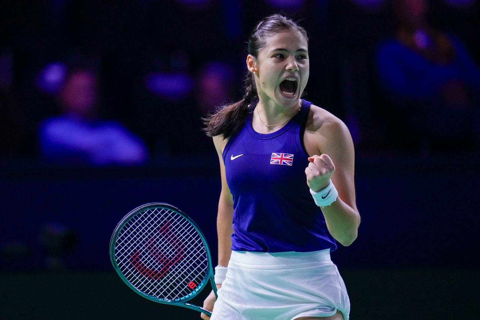 Emma Raducanu of Britain celebrates a point against Germany's Jule Niemeier during the Billie Jean King Cup Finals, at the Martin Carpena Sports Hall, in Malaga, southern Spain, on Friday, Nov. 15, 2024. (AP Photo/Manu Fernandez)