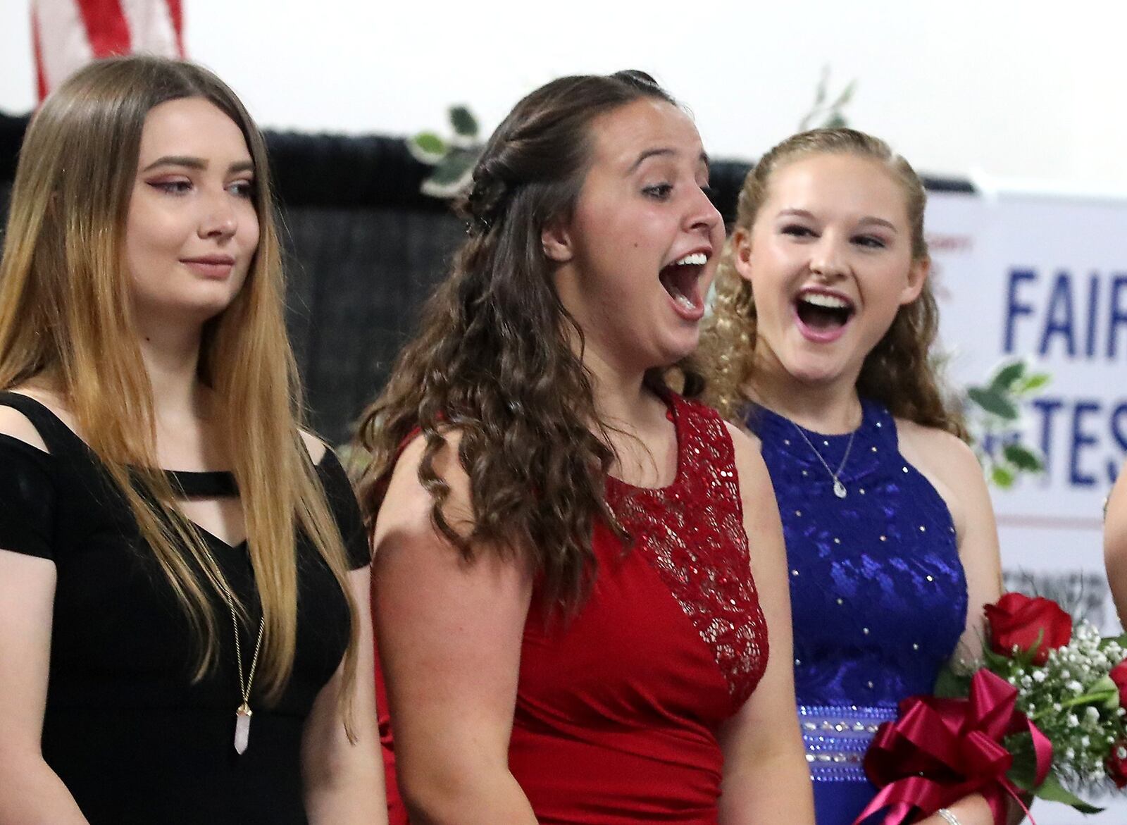 Emma Hardacre, center, reacts as her name is announced as the 2018 Clark County Fair Queen Saturday, July 21, 2018. Emma is from the Global Impact STEM Academy. Her mother was also a Clark County Fair Queen. BILL LACKEY/STAFF