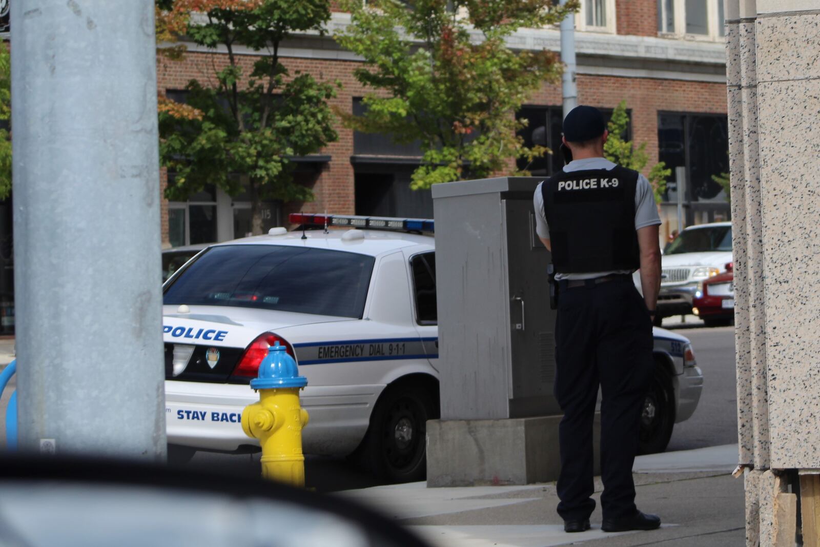 A Dayton police K-9 officer in downtown Dayton. CORNELIUS FROLIK / STAFF